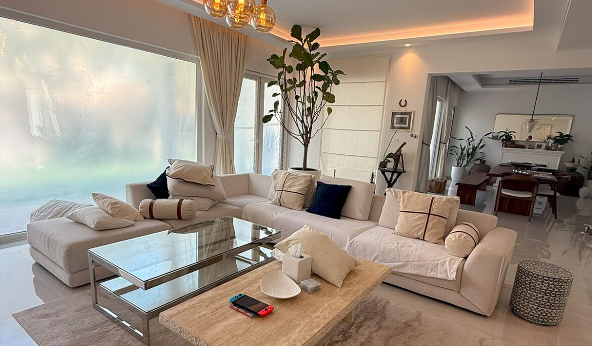 A living room with a couch and coffee table