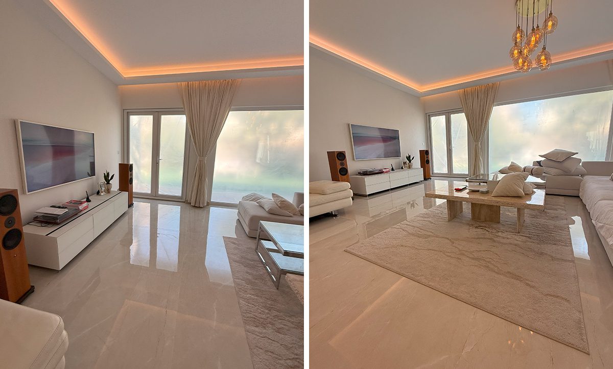 a room with a large window and a couch