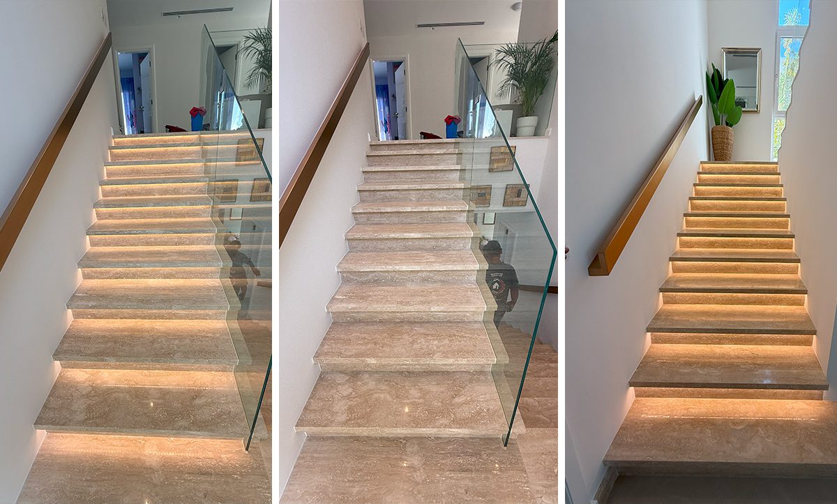 a staircase with glass railings